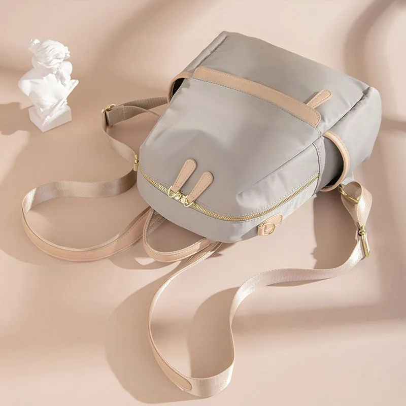 Elegant Lightweight Urban Chic Backpack with Gold-Tone Accents – Sleek Design with Contrast Zipper Details
